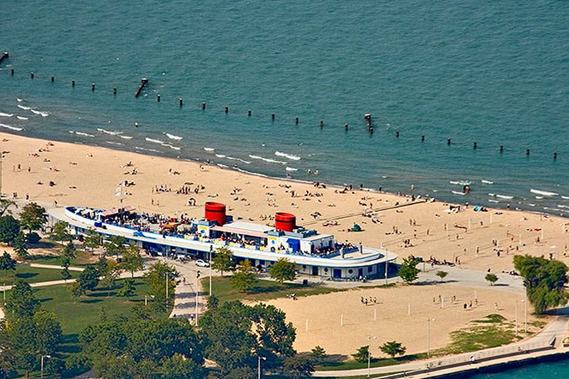 Aerial view of North Avenue Beach on Lake Michigan and the ship-shaped Castaways building