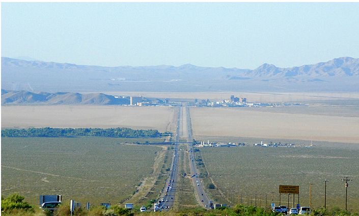 Interstate 15 running straight across the desert toward the hotels of Las Vegas